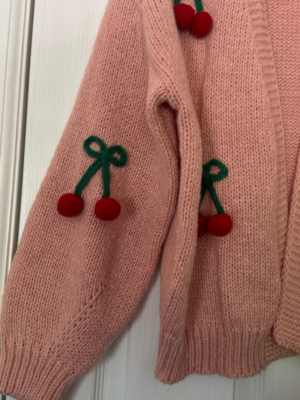 Pink Luna Ivy cardigan featuring prominent green and red 3D cherry appliqués. - Picture 5 of 6